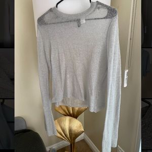 Sheer lightweight sweater-trumpet sleeves.